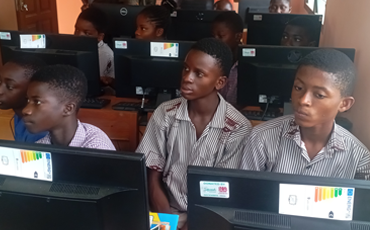 Students learning graphic design during Creative Impact training