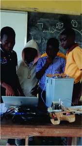 Volunteers assisting students during Rural Tech Hub IT training